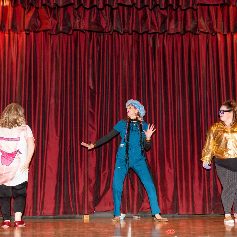 three women having fun and dancing